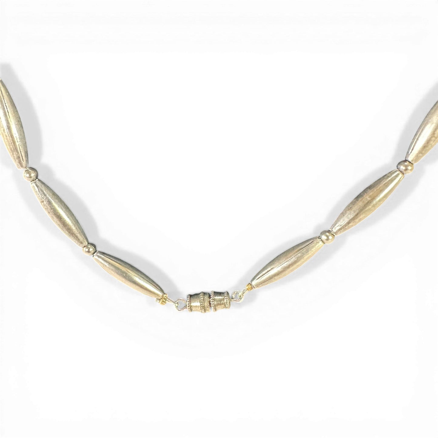 Full length view of 27.5-inch necklace showing coral, turquoise, and silver bead arrangement laid flat