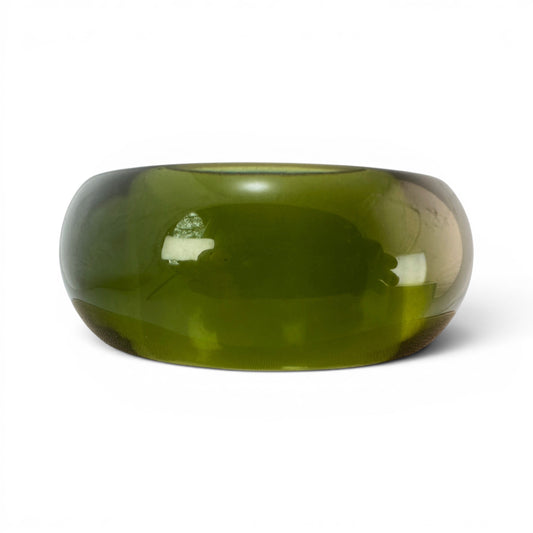 Top-down view of olive green Lucite bangle showing straight-walled interior bore with visible fine mesh or textile liner a...