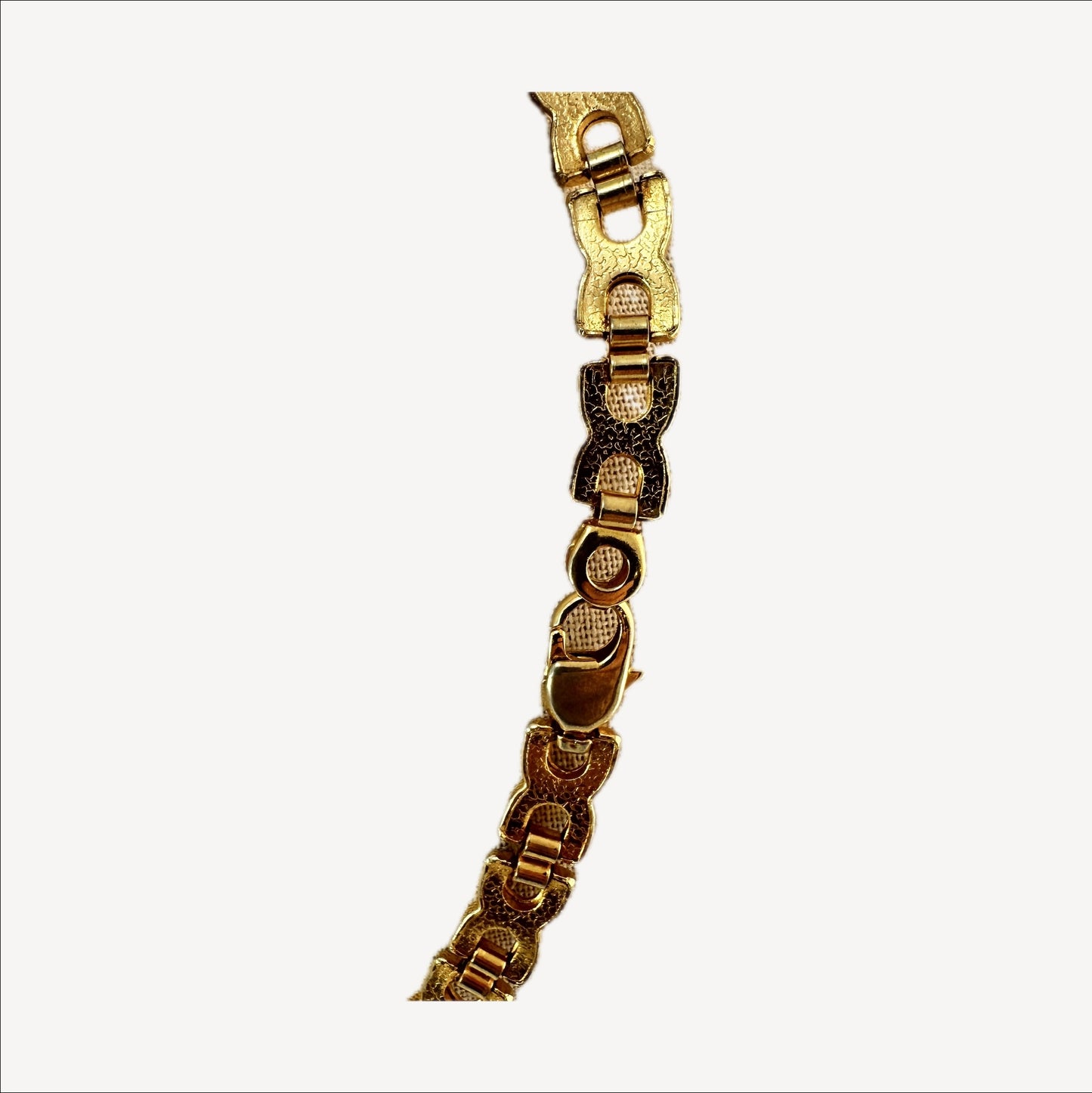 Two-tone link necklace — macro of link construction and finish