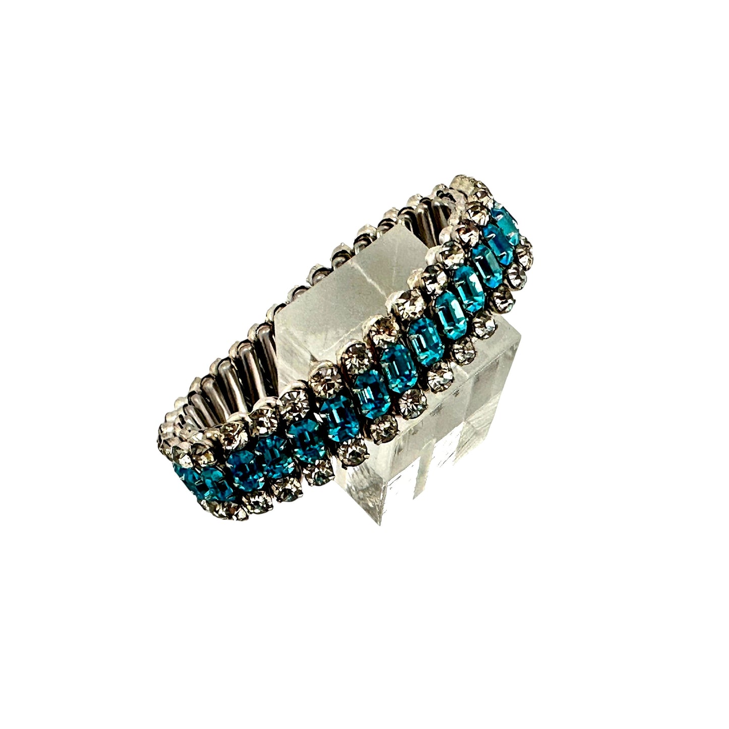Close view of mid-century stretch bracelet showing three-row rhinestone design with accordion-style silver-tone expansion ...