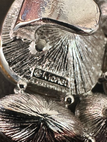 Monet signature cartouche on the clasp back — ©Monet maker's mark close-up