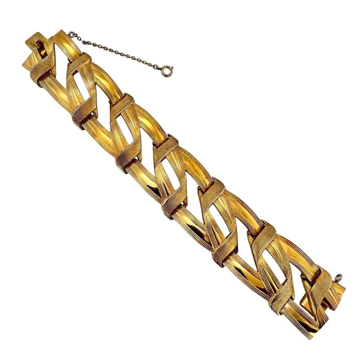 Vintage Grosse gold-tone woven link bracelet, top view on white background