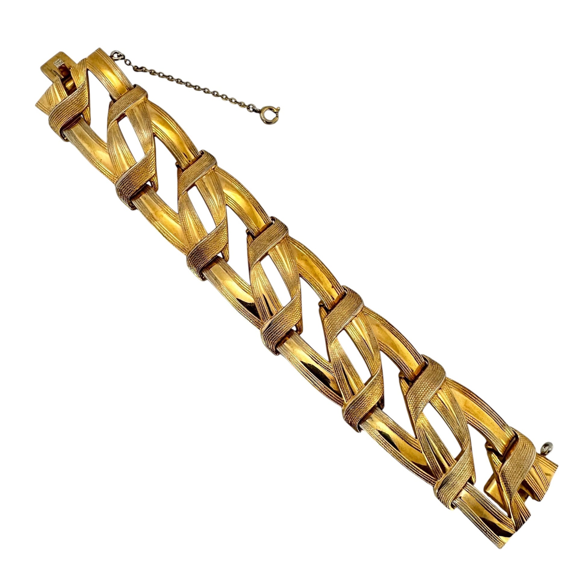 Vintage Grosse gold-tone woven link bracelet, top view on white background