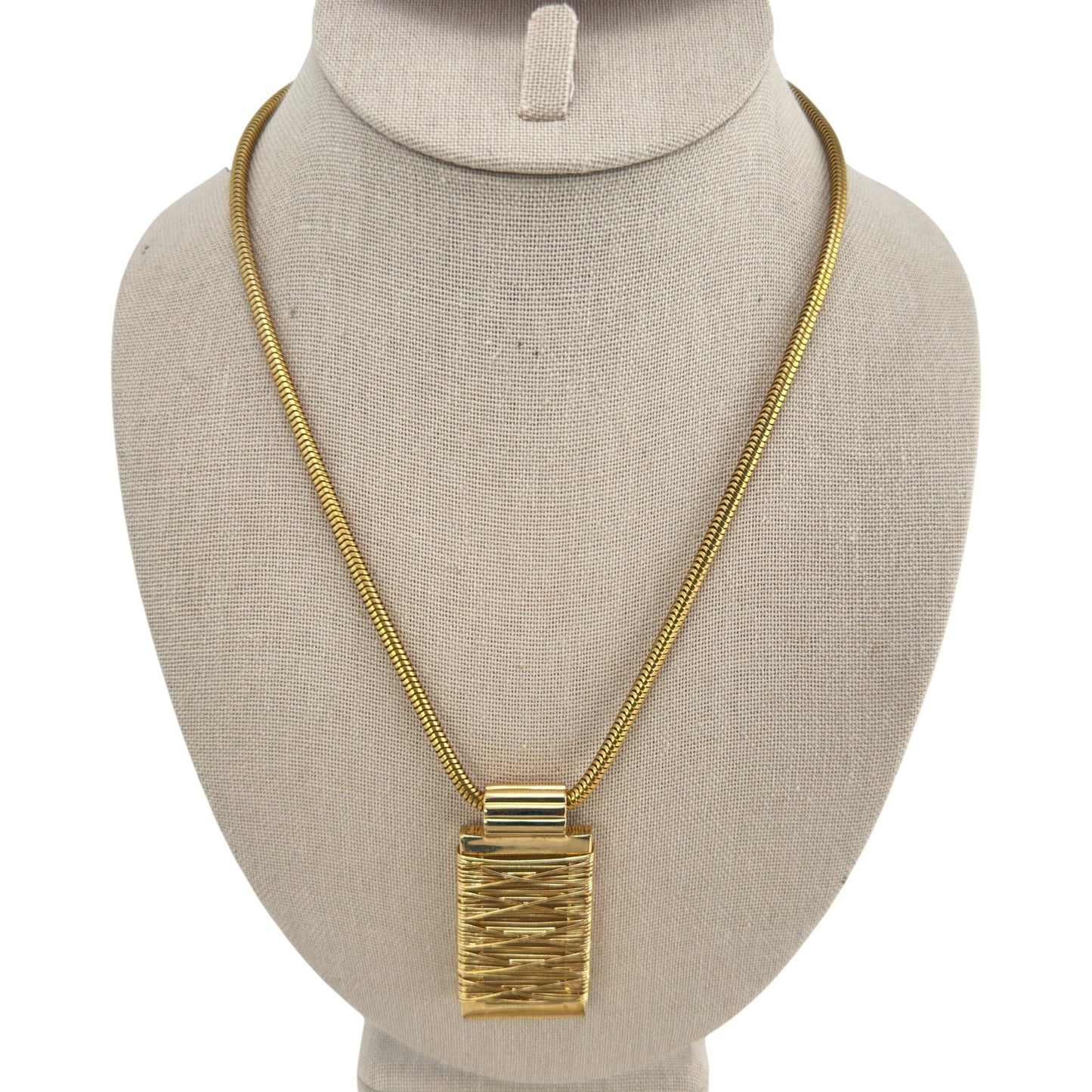 Sculptural gold-tone pendant necklace – front view