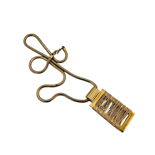 Sculptural gold-tone pendant necklace – angled view