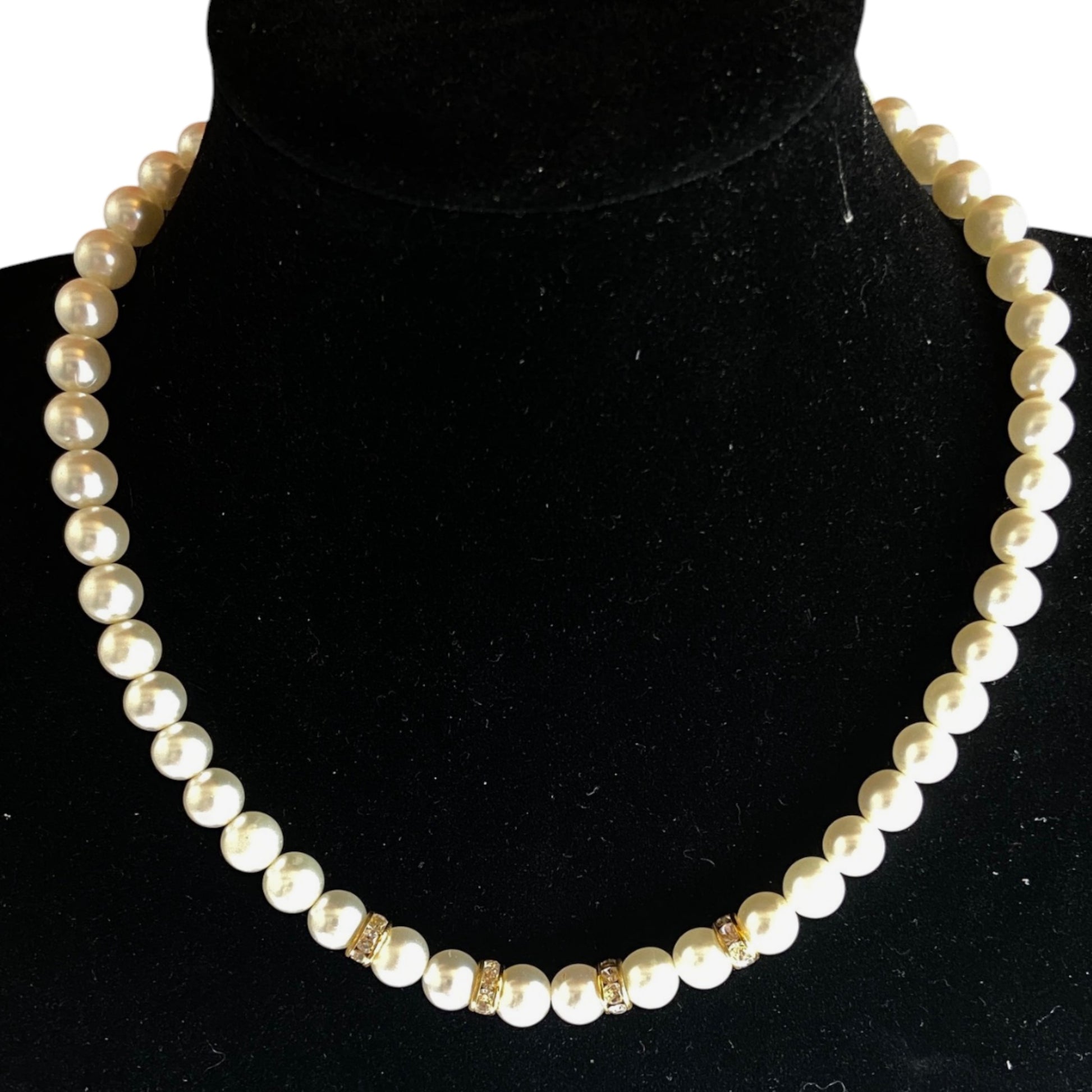 Single-strand graduating freshwater pearl choker with five gold-tone rhinestone rondelle spacers at center front, approx. ...