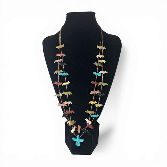 Two-strand heishi shell fetish necklace with hand-carved stone animal figurines strung laterally across both strands and a...