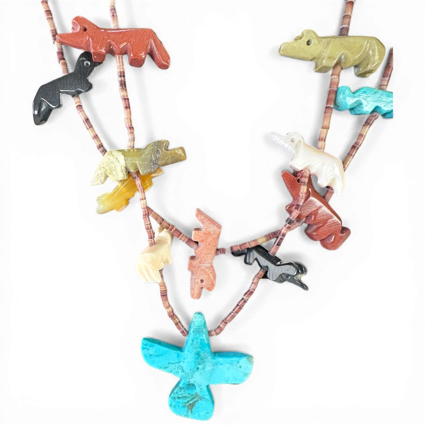Large hand-carved turquoise thunderbird centerpiece pendant in spread-wing position on two-strand heishi shell necklace