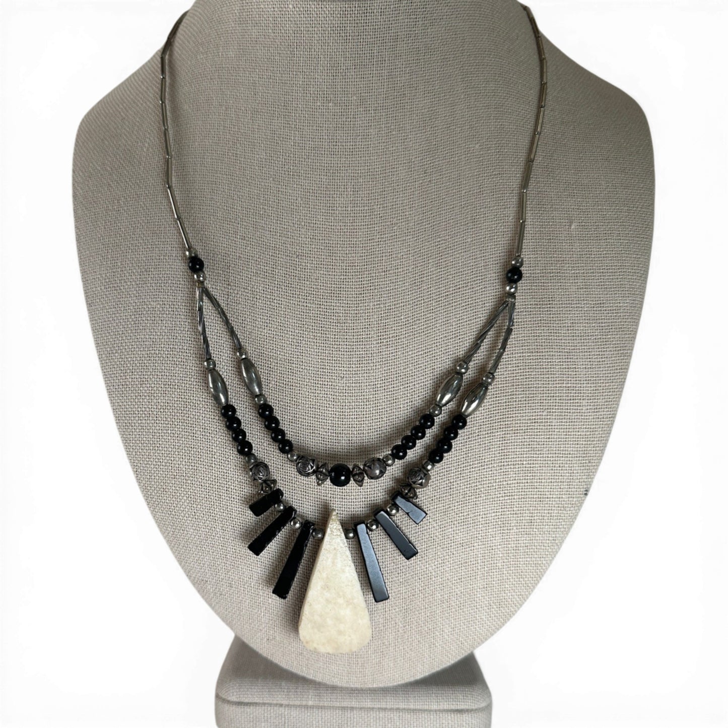 Two-strand sterling silver Southwestern necklace with mosaic teardrop inlay pendant showing kokopelli figure in turquoise,...