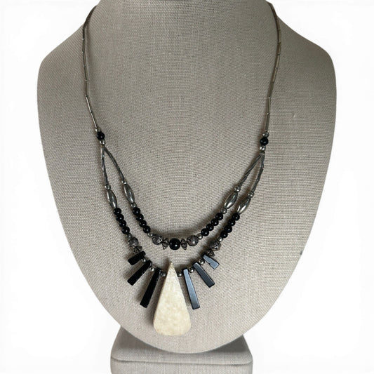 Two-strand sterling silver Southwestern necklace with mosaic teardrop inlay pendant showing kokopelli figure in turquoise,...
