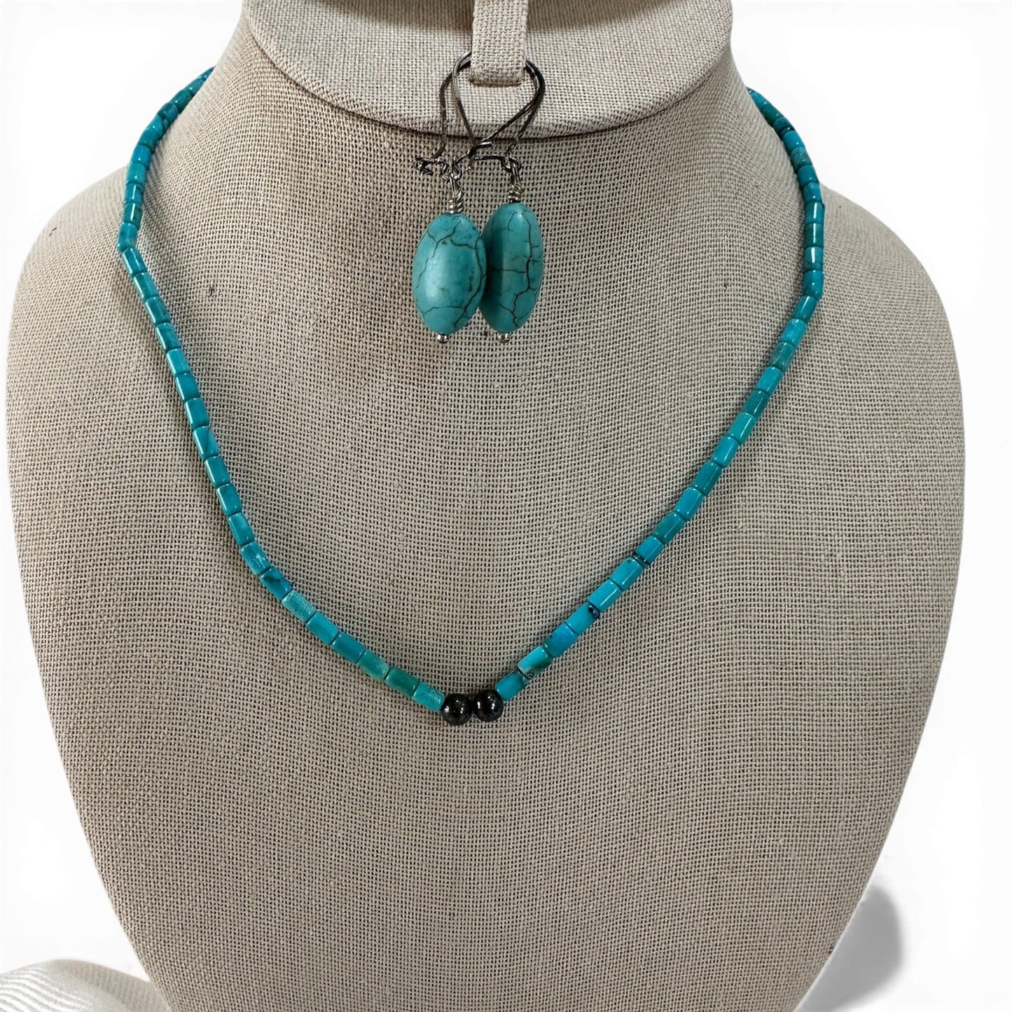Pair of oval faux turquoise drop earrings with visible matrix veining on elongated kidney lever-back ear wires, 2 inches long