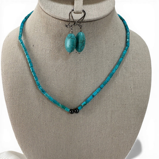 Pair of oval faux turquoise drop earrings with visible matrix veining on elongated kidney lever-back ear wires, 2 inches long