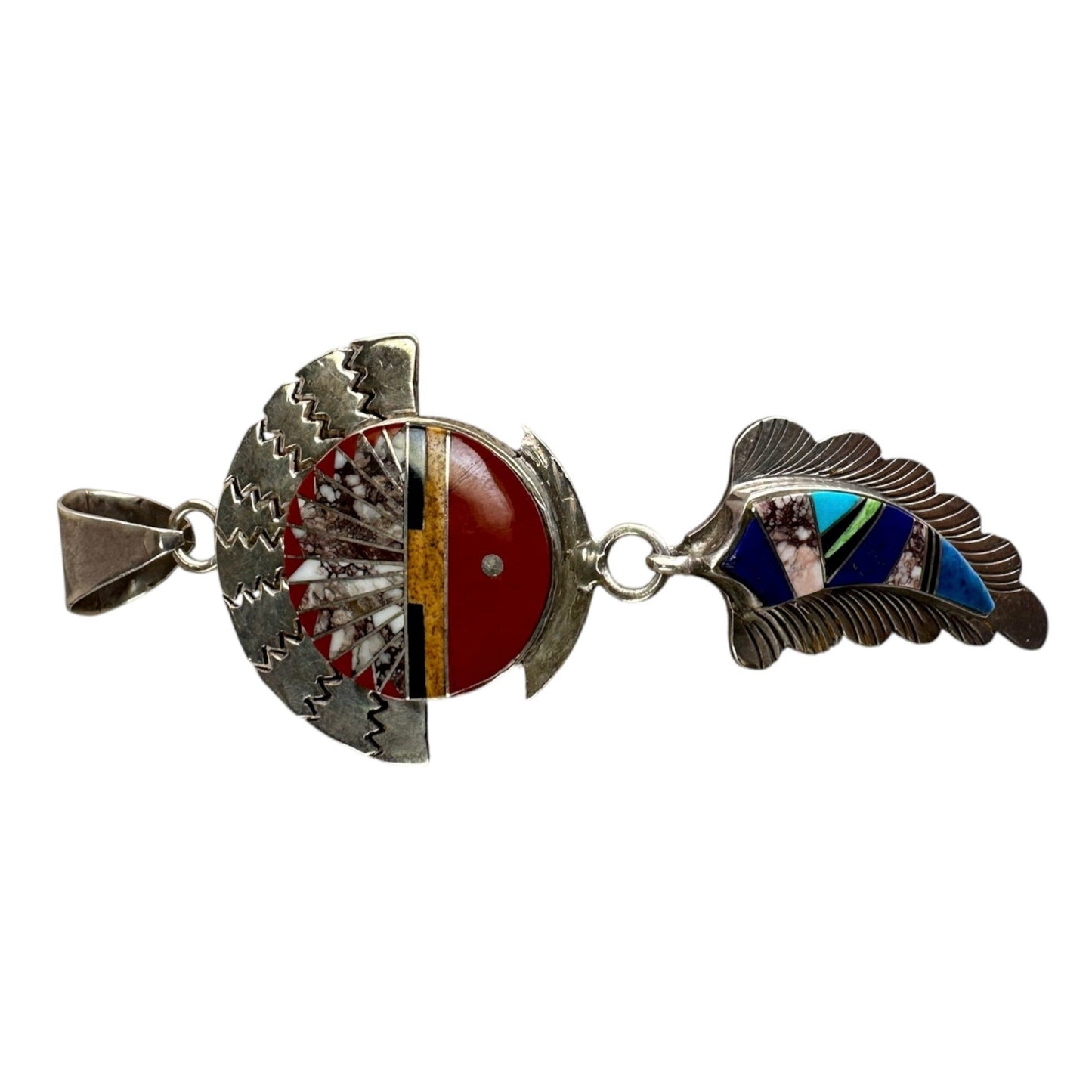 Close-up of circular sun face motif with coral, turquoise, lapis, spiny oyster, onyx, and jasper mosaic inlay on sterling ...
