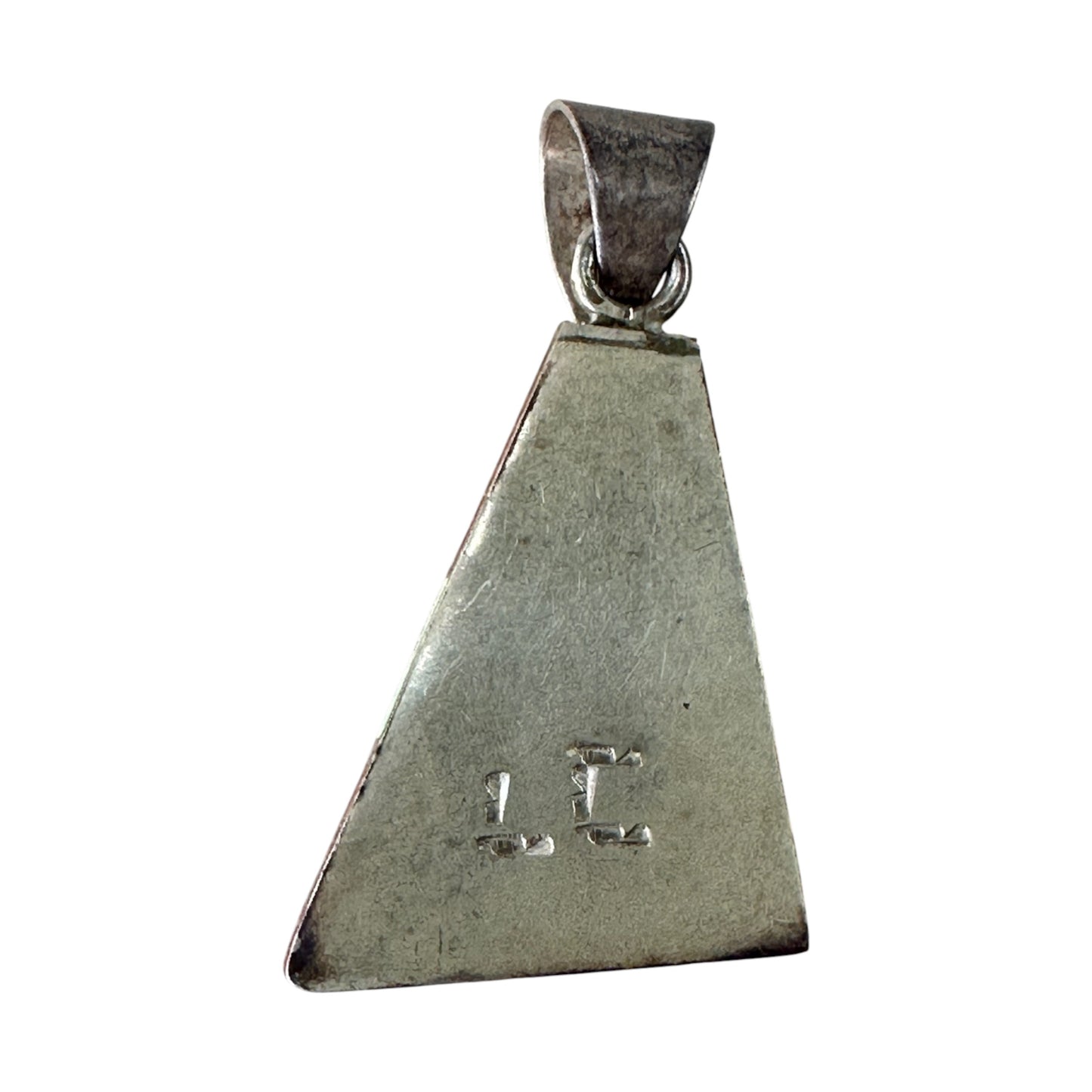Close-up of raised inner triangle and stepped layered channel inlay detail in coral and opal on sterling silver pendant