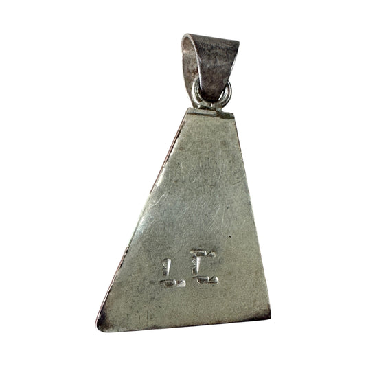 Close-up of raised inner triangle and stepped layered channel inlay detail in coral and opal on sterling silver pendant