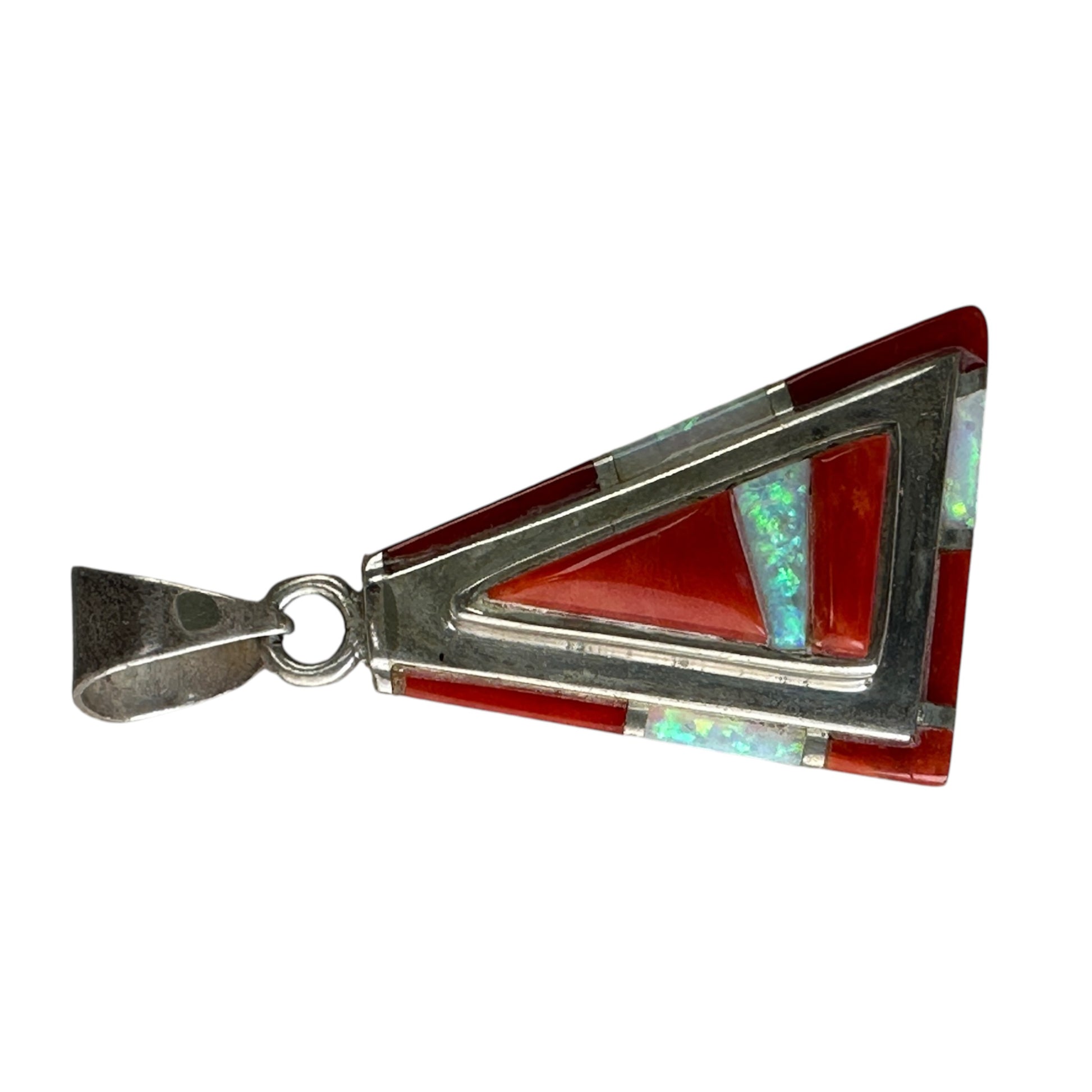 Reverse of sterling silver triangular pendant showing flat backing plate with stamped LC maker's initials
