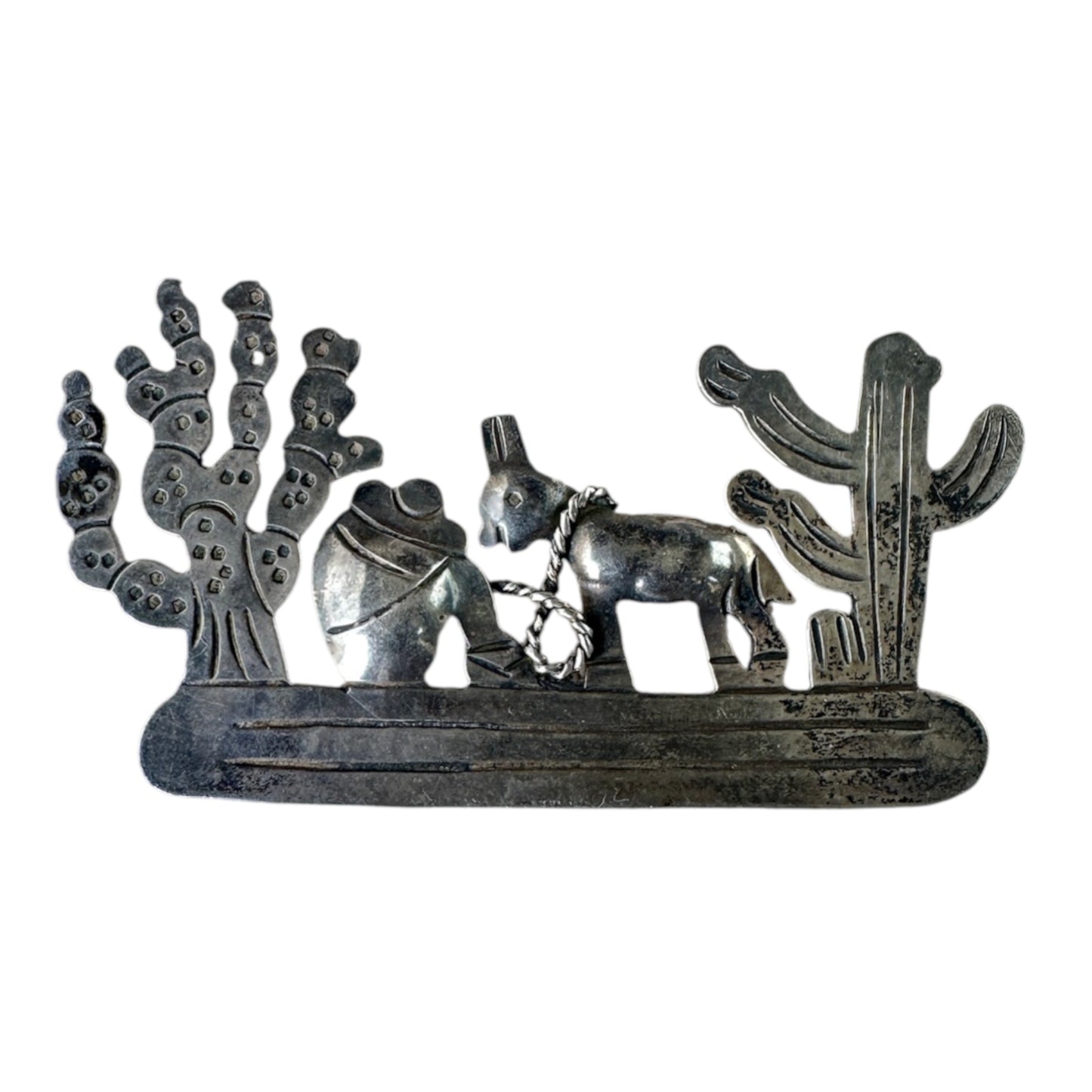 TAXCO 980 silver brooch depicting seated figure in sombrero with burro on twisted wire rope, saguaro and prickly pear cact...