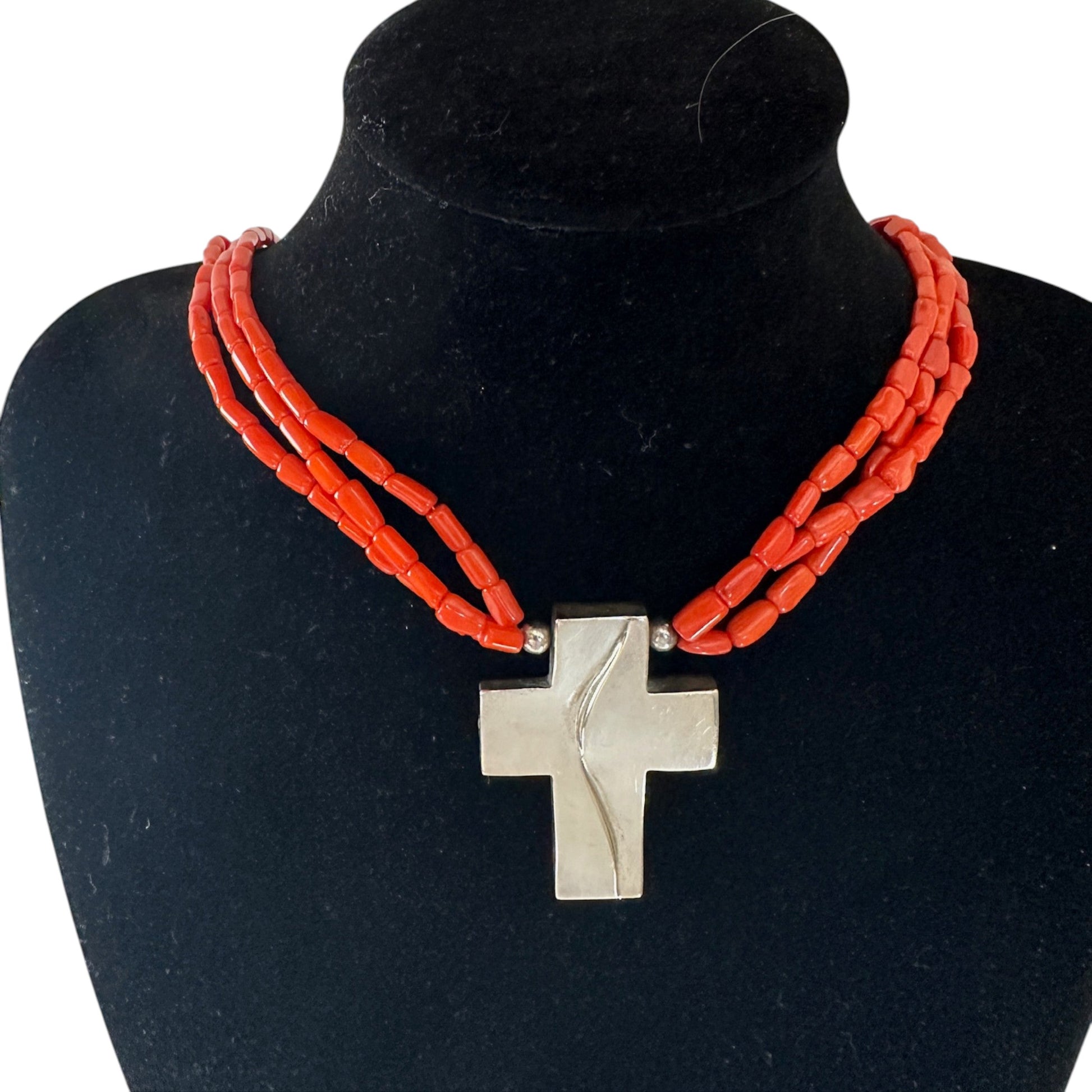 DTR three-strand orange-red coral bead necklace with flat sterling silver cross pendant, front view, 925 stamped
