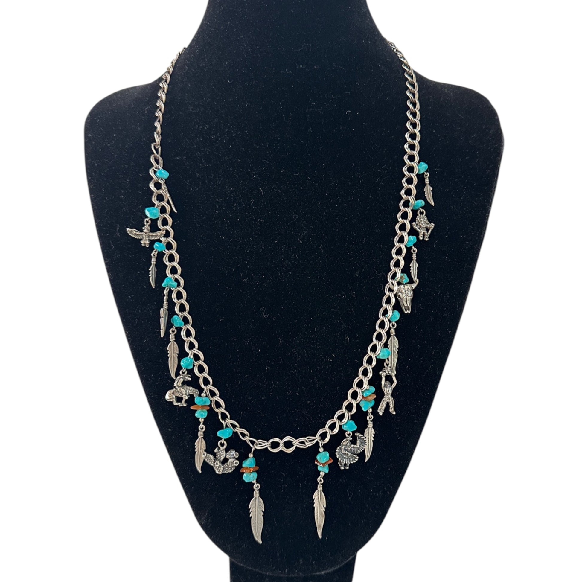 Sterling silver double curb-link charm necklace by ST with turquoise nuggets, spiny oyster chips, and seven Southwestern f...