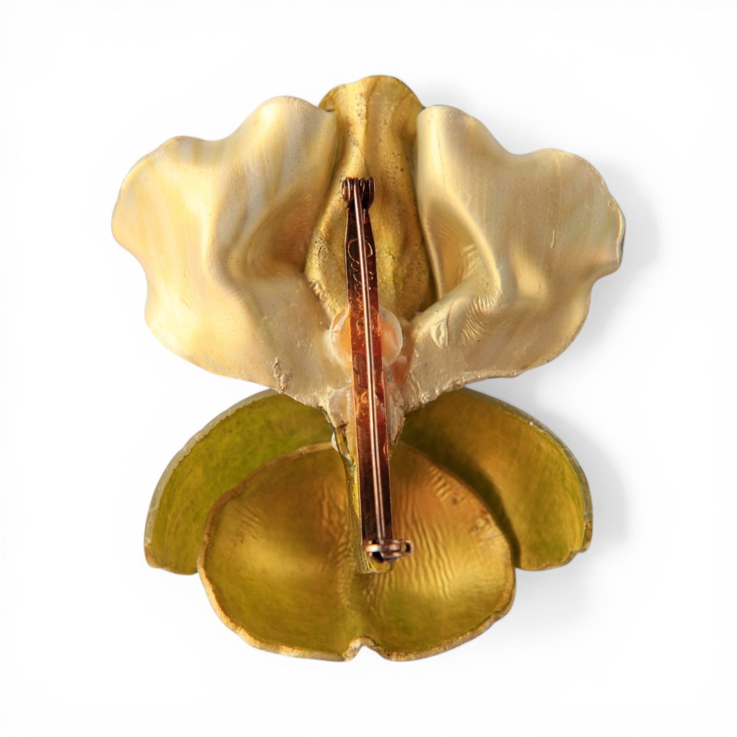 Close-up of ruffled upper petals and rounded lower petals with layered green amber and dark green enamel striations on res...