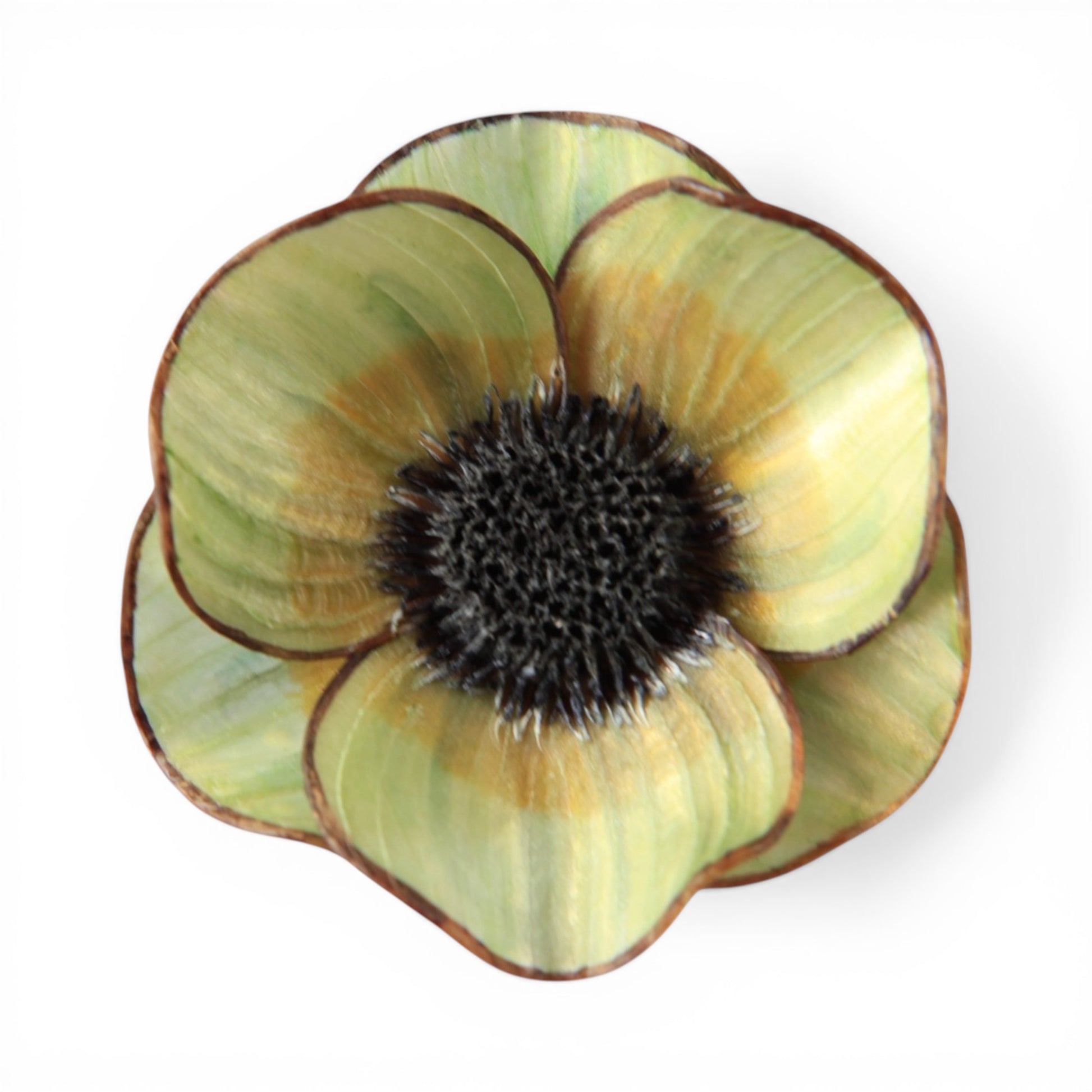 Cilea floral brooch with layered sage green and golden amber resin petals, dark brown edges, and textured seed-head center...