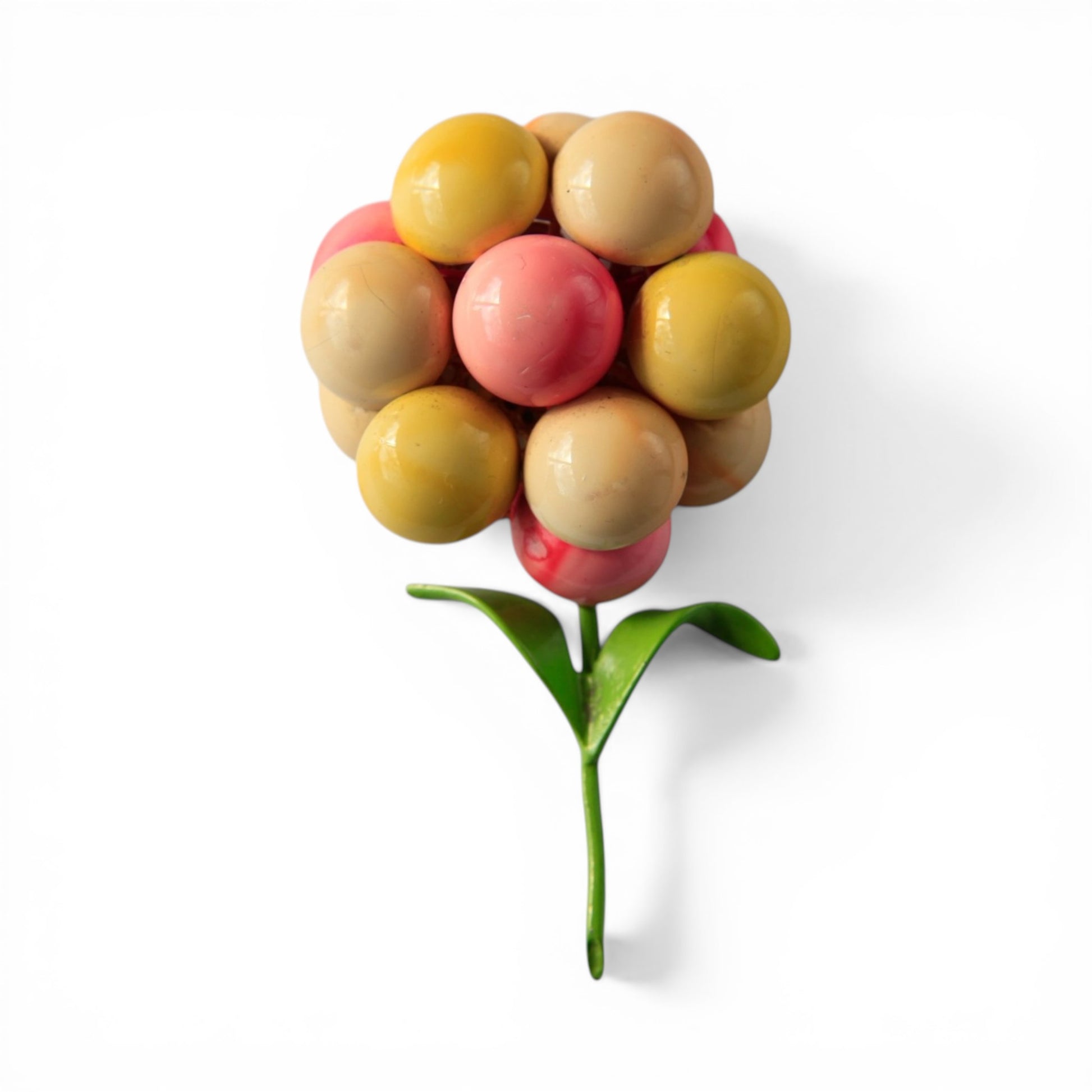 Mod era floral cluster brooch with glossy domed balls in mustard yellow, coral pink, tan, and beige on a green enamel stem...