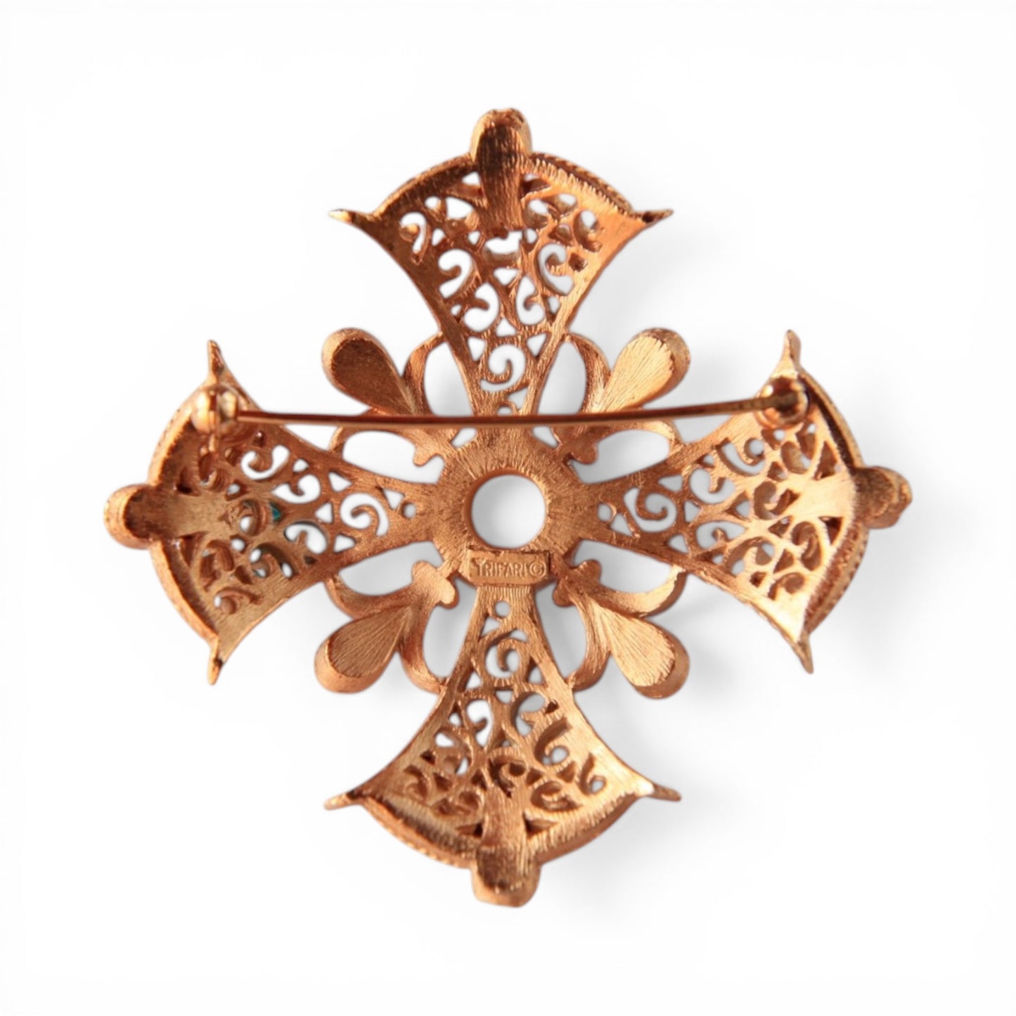 Reverse of Trifari Maltese cross brooch showing gold-tone cast filigree, horizontal pin-stem bar clasp, and stamped maker'...