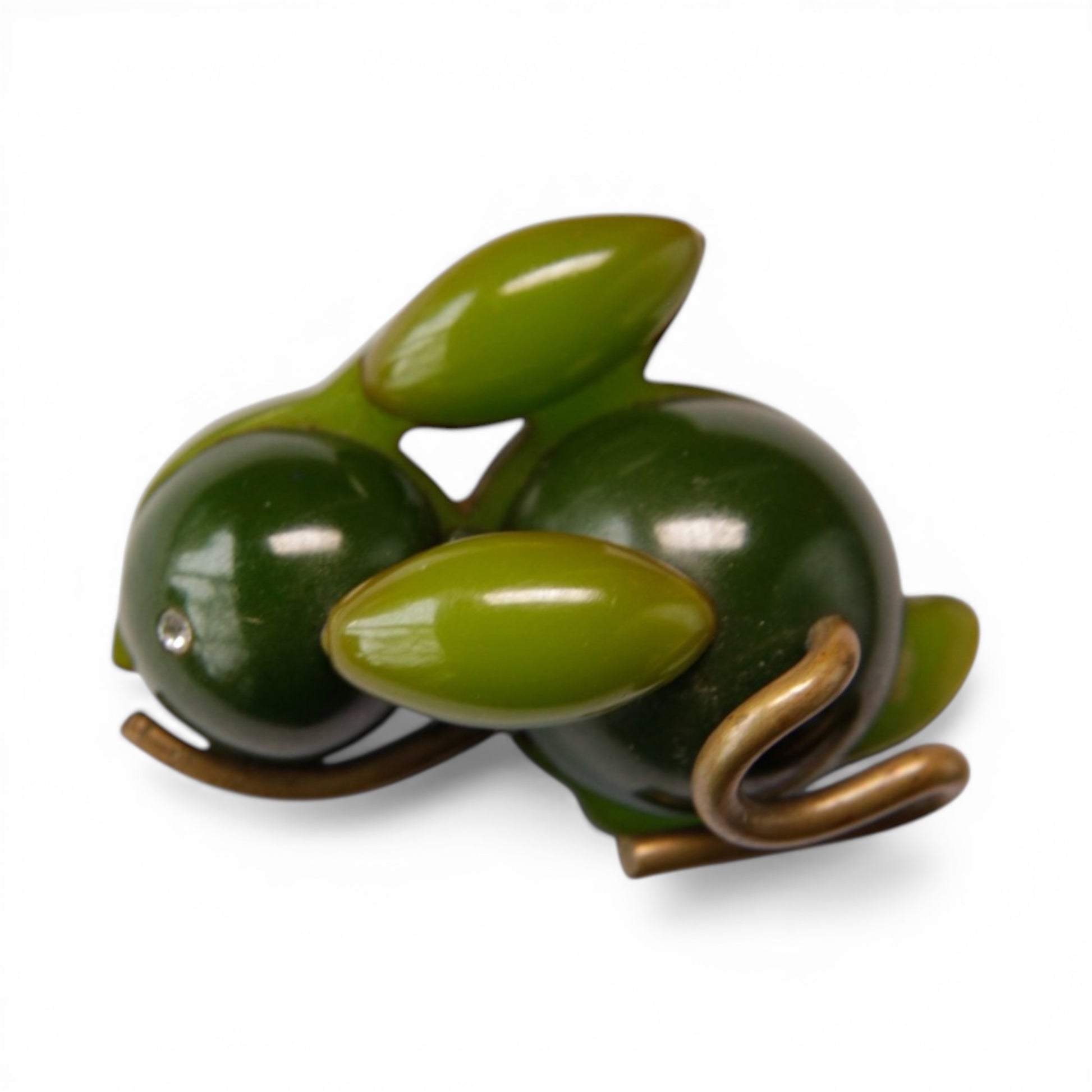 Figural crouching rabbit brooch made of dark forest green and apple green domed Bakelite pieces on a brass armature, appro...