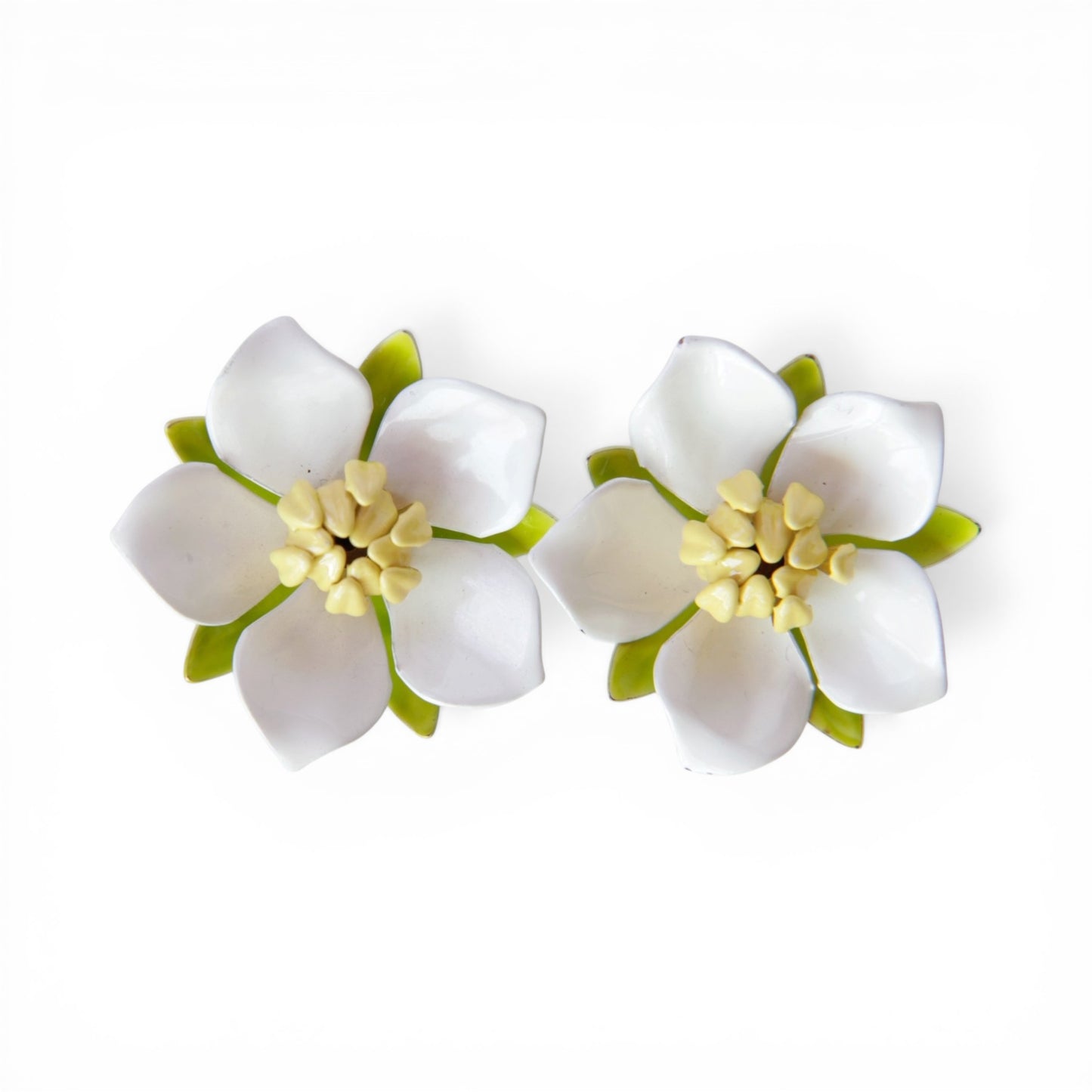 SARAH COV clip-on earrings, five white enamel petals with pale yellow stamen cluster and chartreuse green enamel sepal lay...