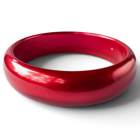 Art Deco deep crimson red Bakelite bangle bracelet with domed cross-section and high-gloss marbled surface, no clasp