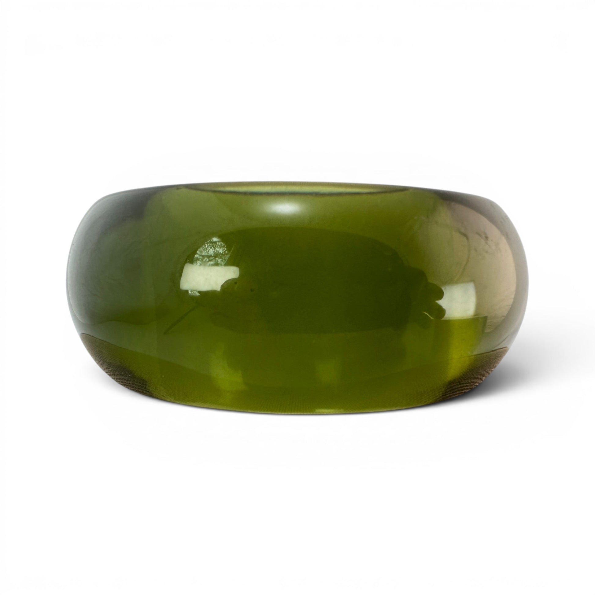 Top-down view of olive green Lucite bangle showing straight-walled interior bore with visible fine mesh or textile liner a...