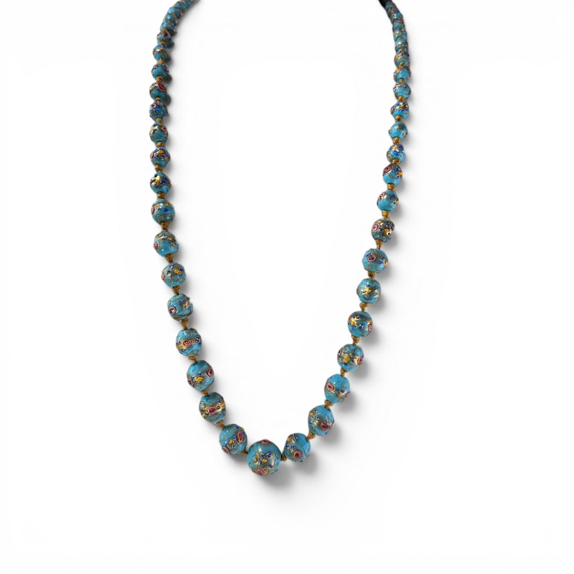 Graduated turquoise-blue Murano glass bead necklace with raised multicolor floral appliqué, hand-knotted on gold-tone cord...
