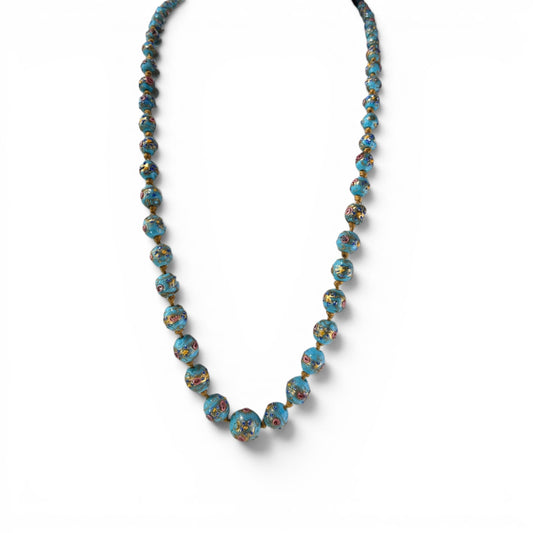 Graduated turquoise-blue Murano glass bead necklace with raised multicolor floral appliqué, hand-knotted on gold-tone cord...