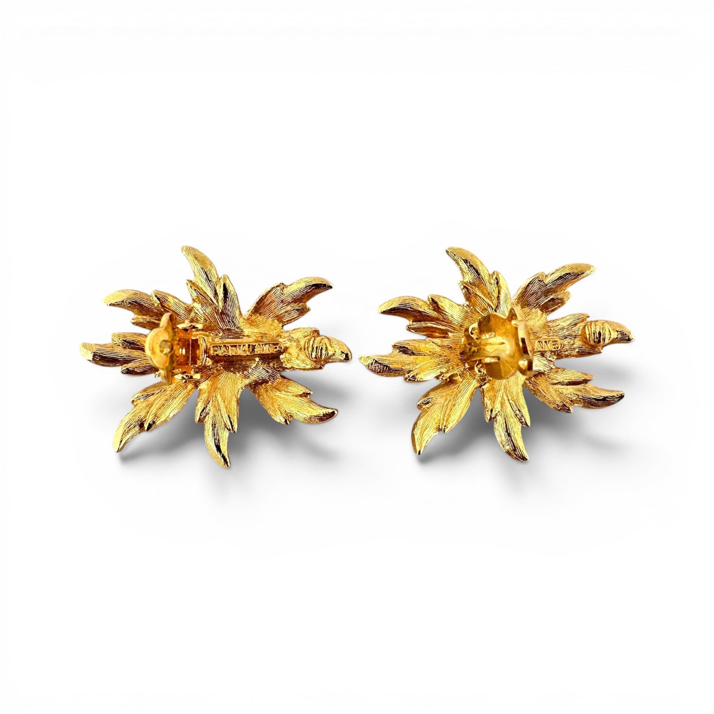 Parklane signed floral earrings displayed flat, gold-tone centre dome bead and silver-tone cast petals with linear engraved...
