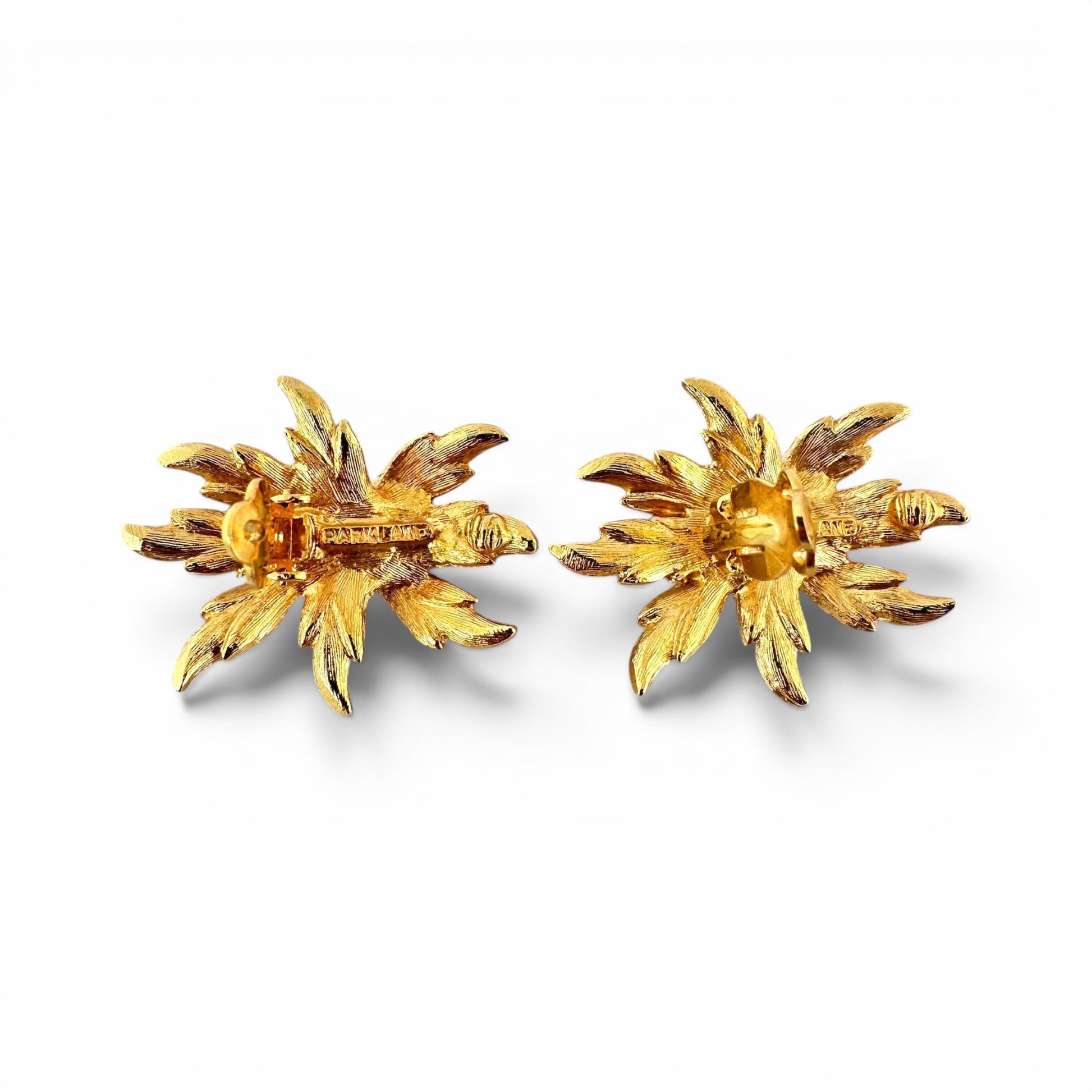 Parklane signed floral earrings displayed flat, gold-tone centre dome bead and silver-tone cast petals with linear engraved...