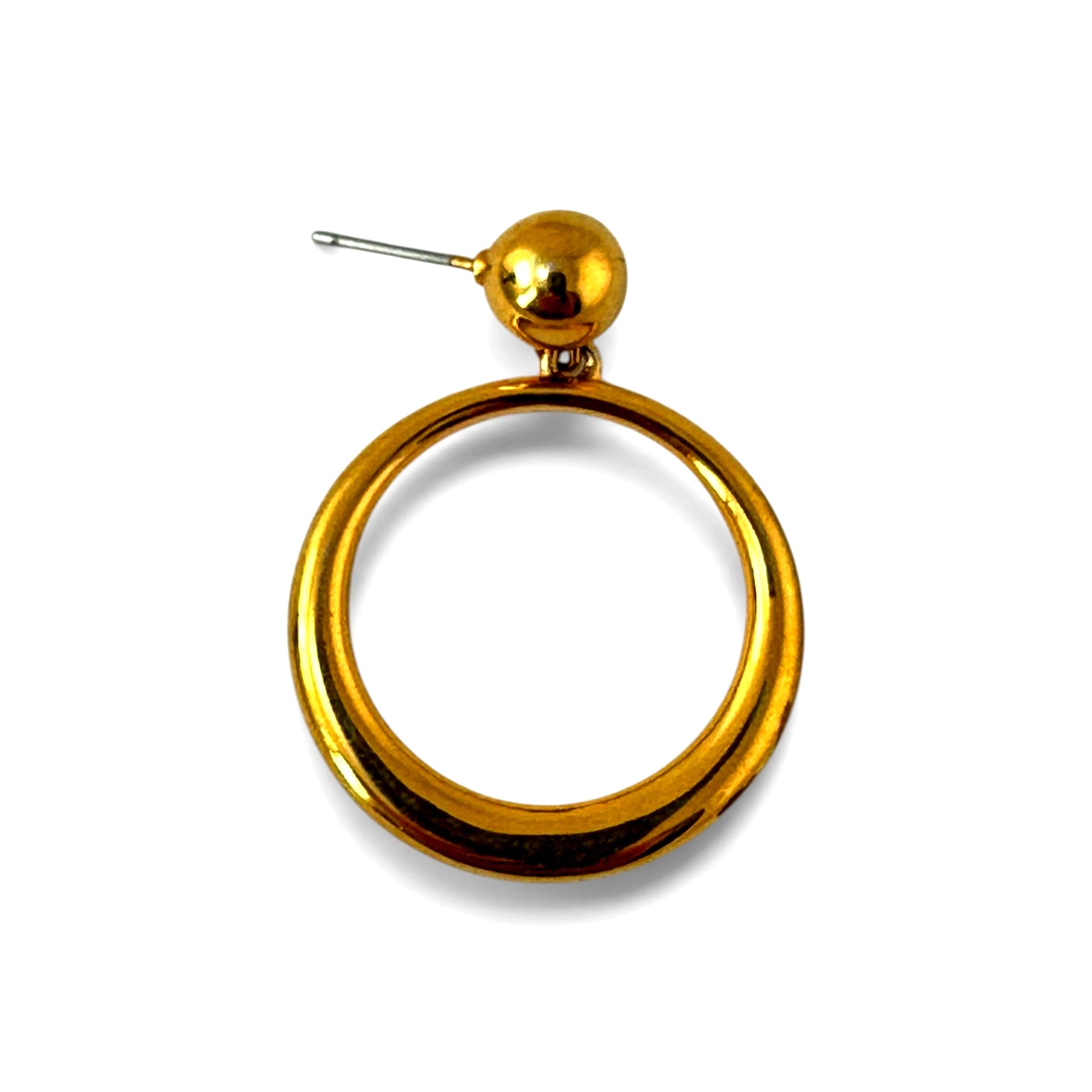 Close-up of gold-tone open hoop earring showing high-polish tubular construction and jump ring attachment to ball stud
