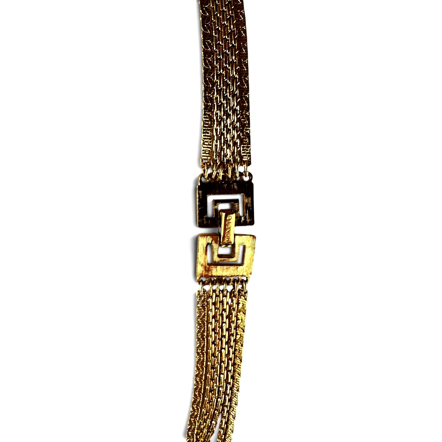Full-length flat lay of Monet gold-tone multi-strand statement necklace showing cascading chain layers and slide keeper