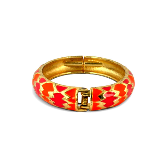 Gold-tone hinged clamper bangle open showing spring-loaded box hinge clasp and smooth undecorated gold-tone interior