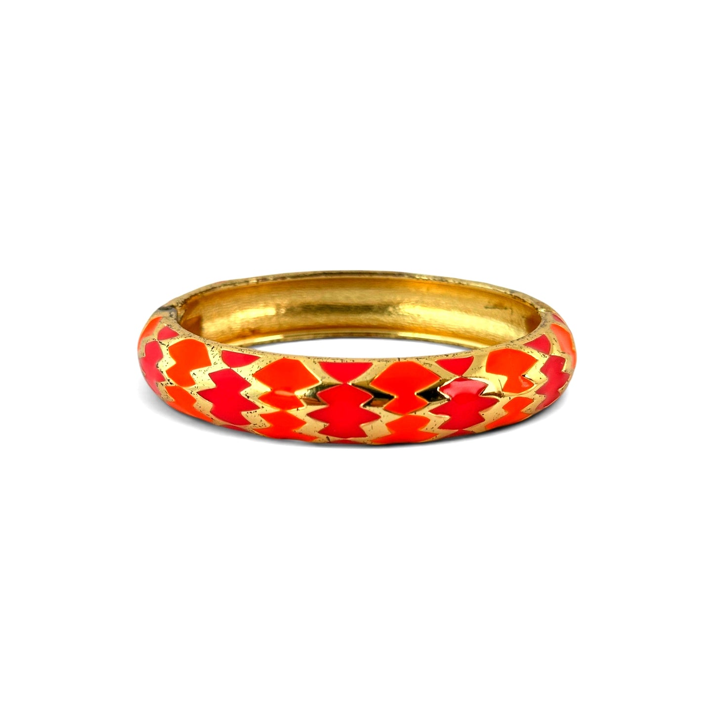 Side profile view of domed gilt metal bangle showing convex shape, enamel chevron pattern, and hinge mechanism detail