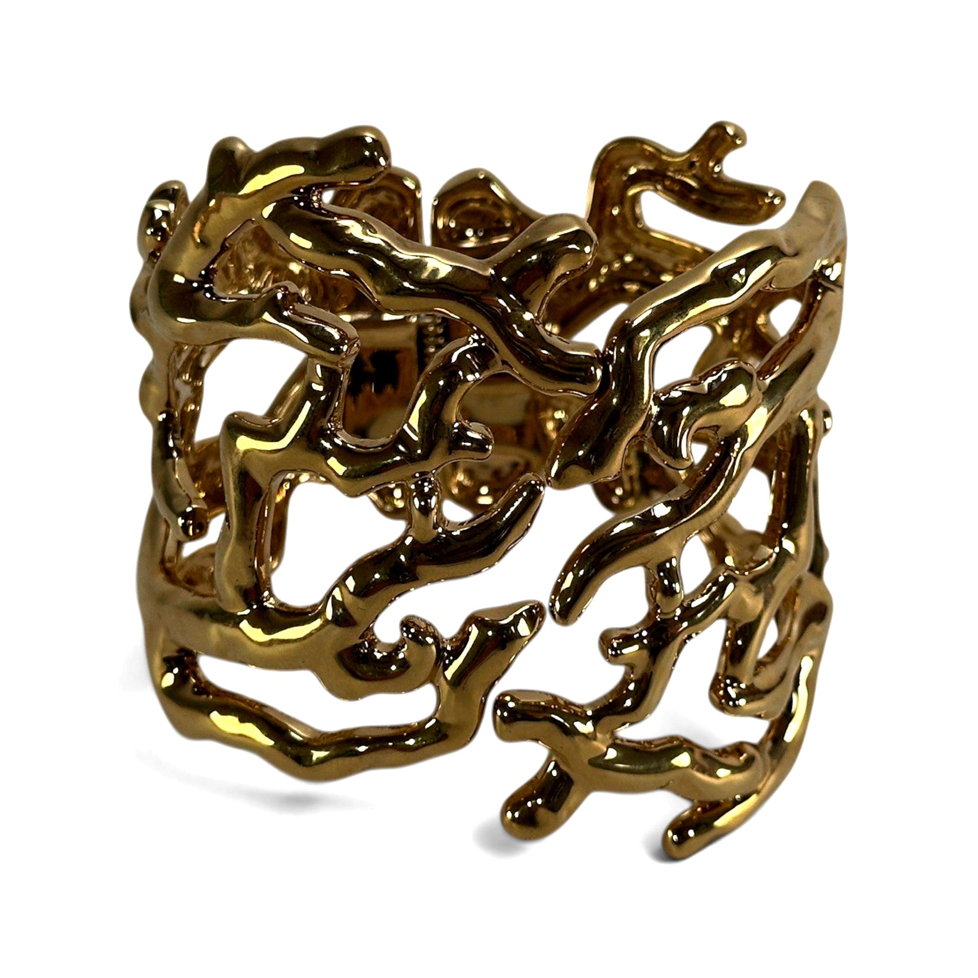 Wide gold-tone hinged cuff bracelet with openwork coral branch motif, high-polish gilt metal surface, approximately 2 inch...