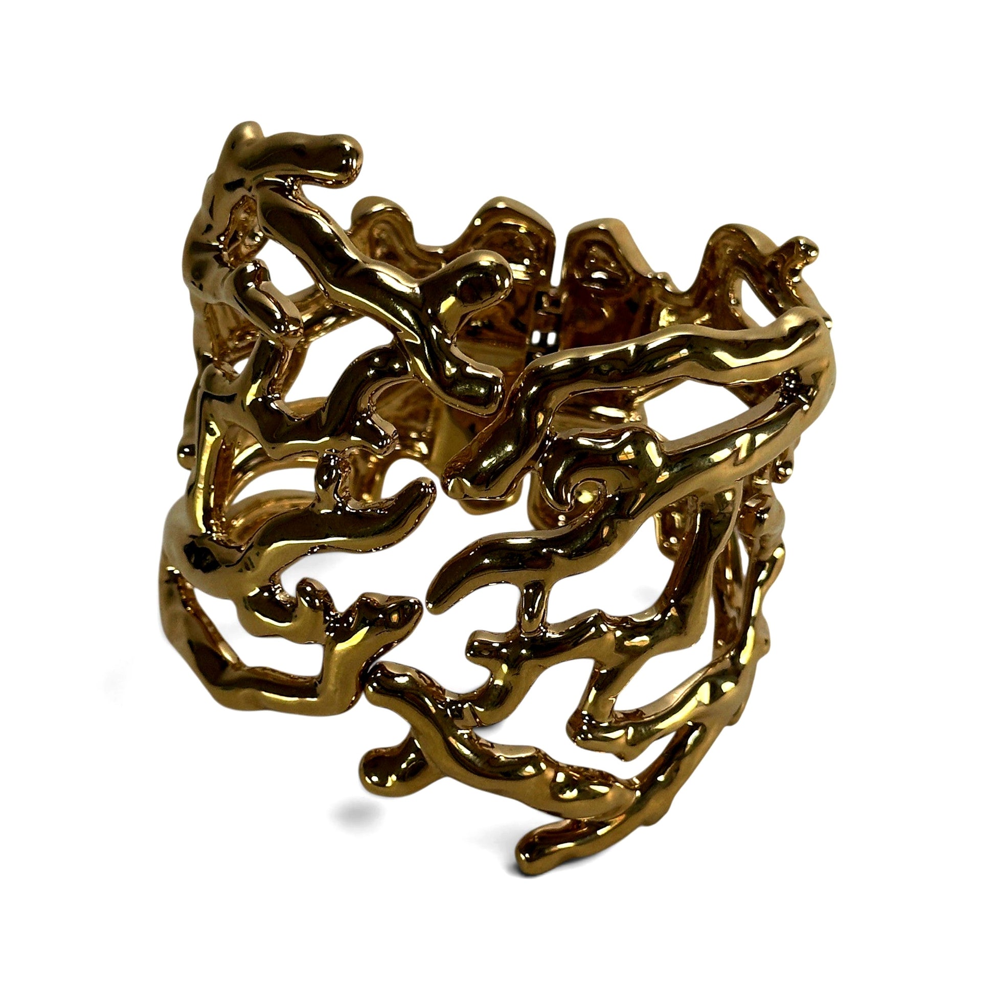 Three-quarter angle view of wide gold-tone openwork cuff bracelet showing curvilinear cutout design across full width