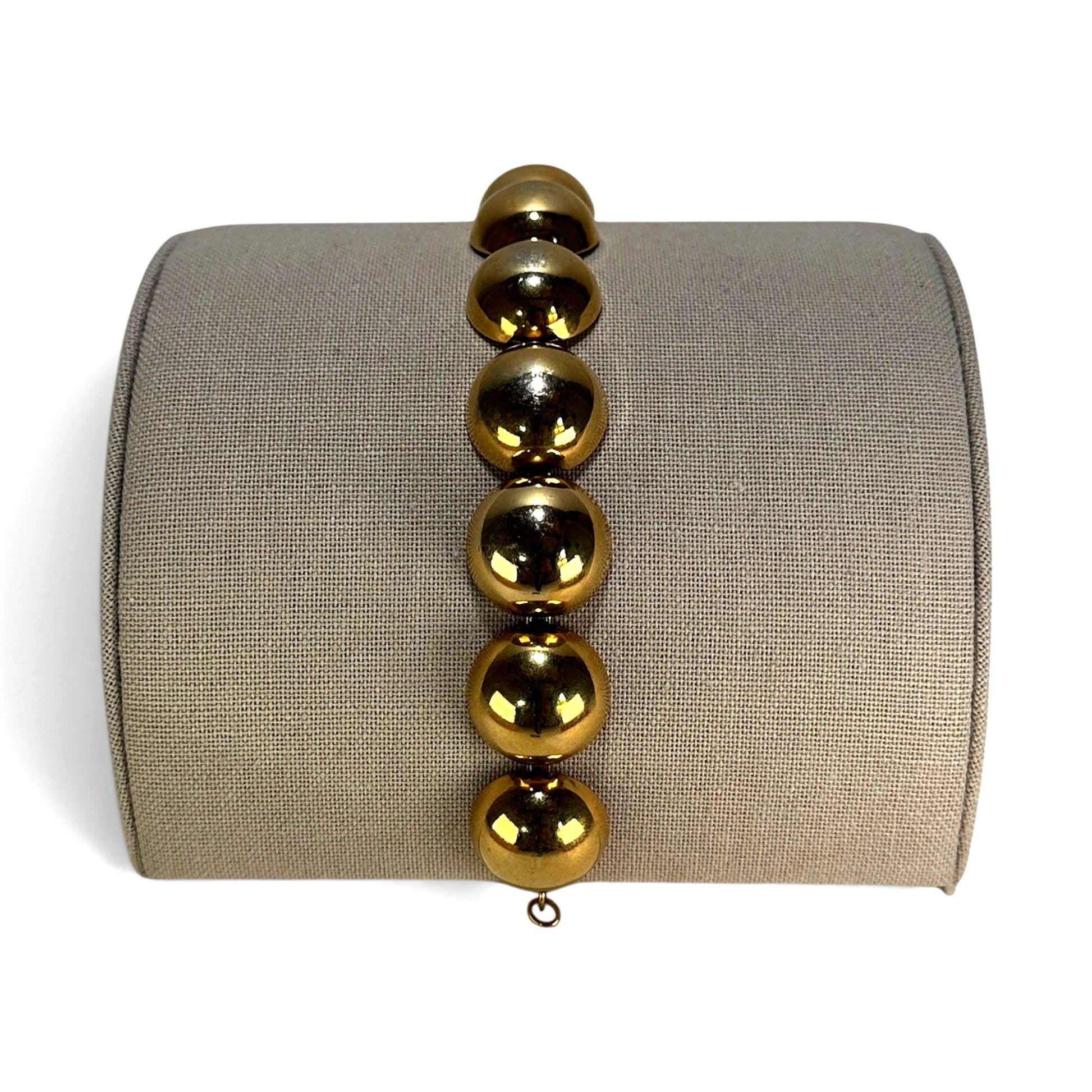 Monet gold-tone bracelet with large polished spherical beads linked by small jump rings, approx. 7 inches long