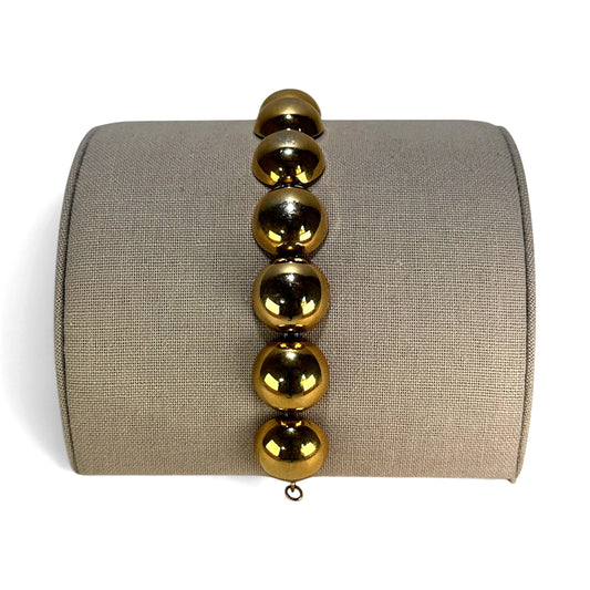 Monet gold-tone bracelet with large polished spherical beads linked by small jump rings, approx. 7 inches long