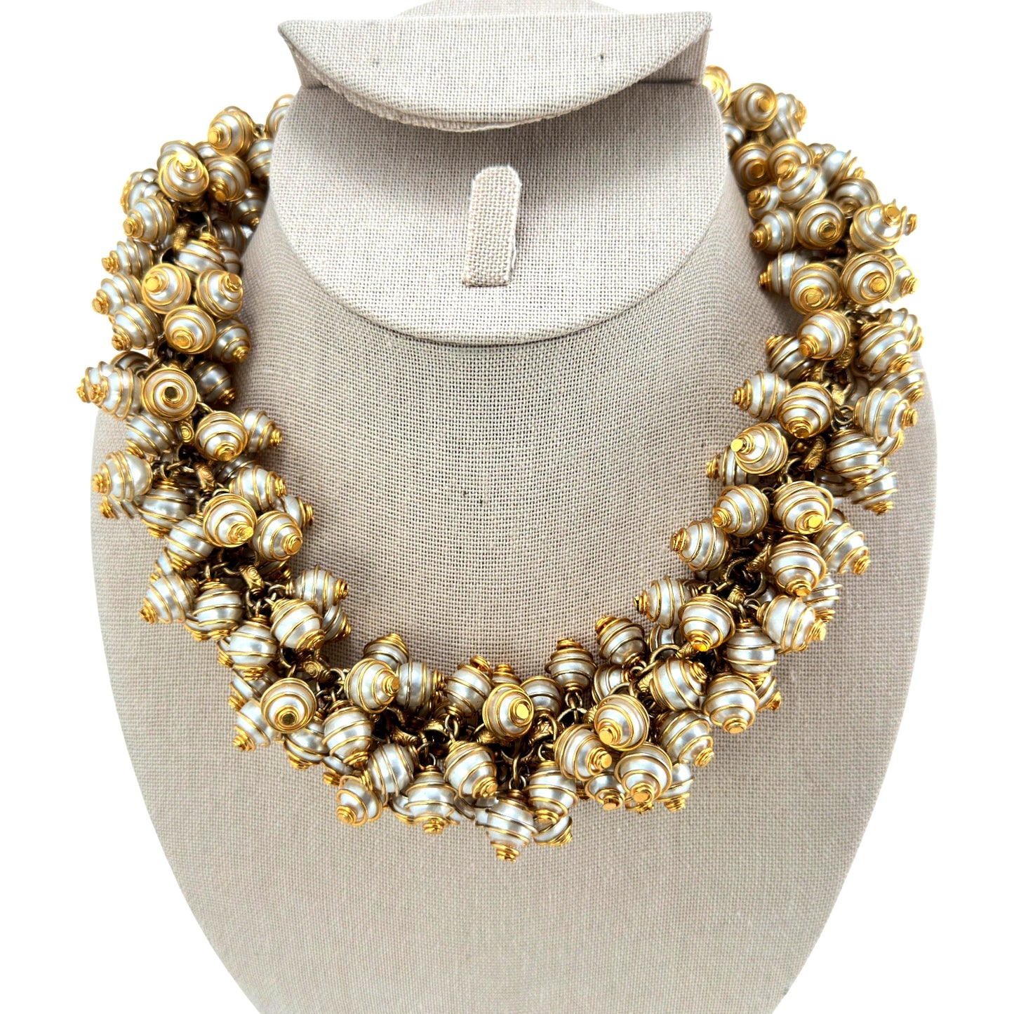 Clustered bib necklace with spiral gold-tone wire-wrapped faux pearl beads linked by jump rings, toggle clasp, front view