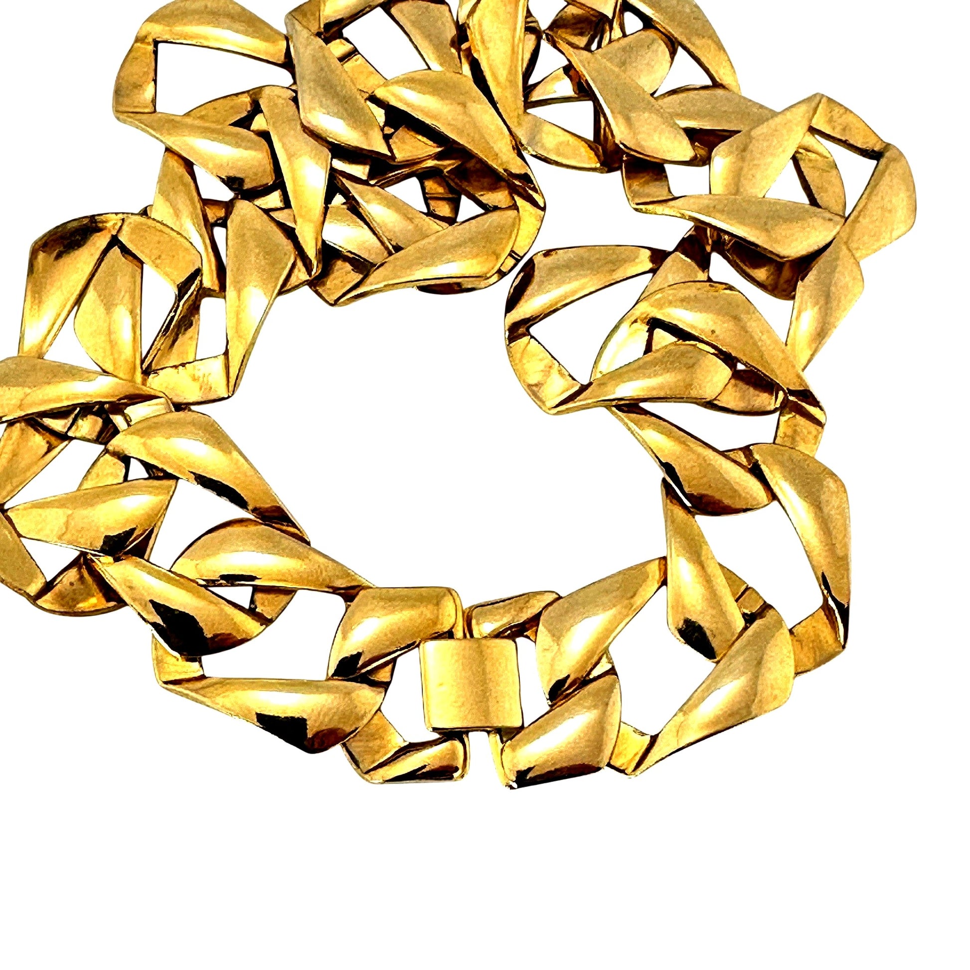 Close-up of gold-tone curb link necklace showing oversized links and clasp