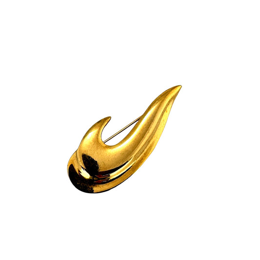 Vintage wave brooch in gold tone, angled view
