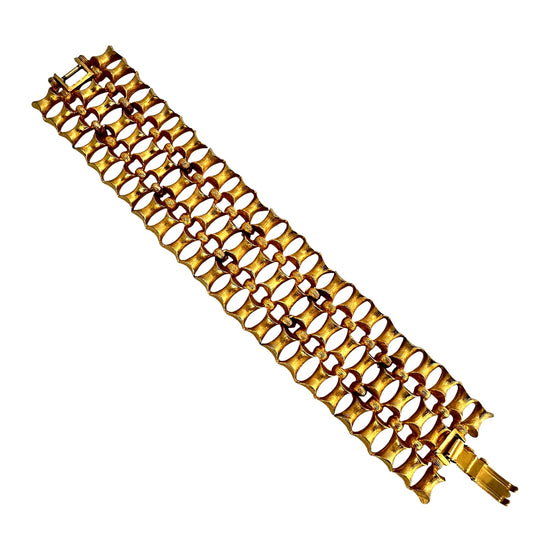 Wide goldtone bracelet with sculptural ridged wave pattern, 1970s modernist style