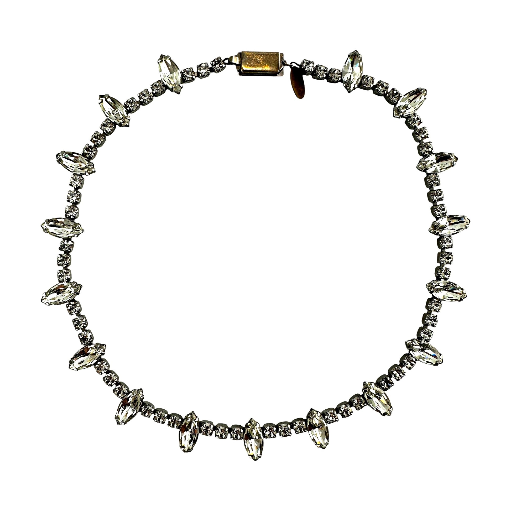 Full-length view of single-strand rhinestone necklace showing continuous linked chain of marquise-cut and round rhinestone...