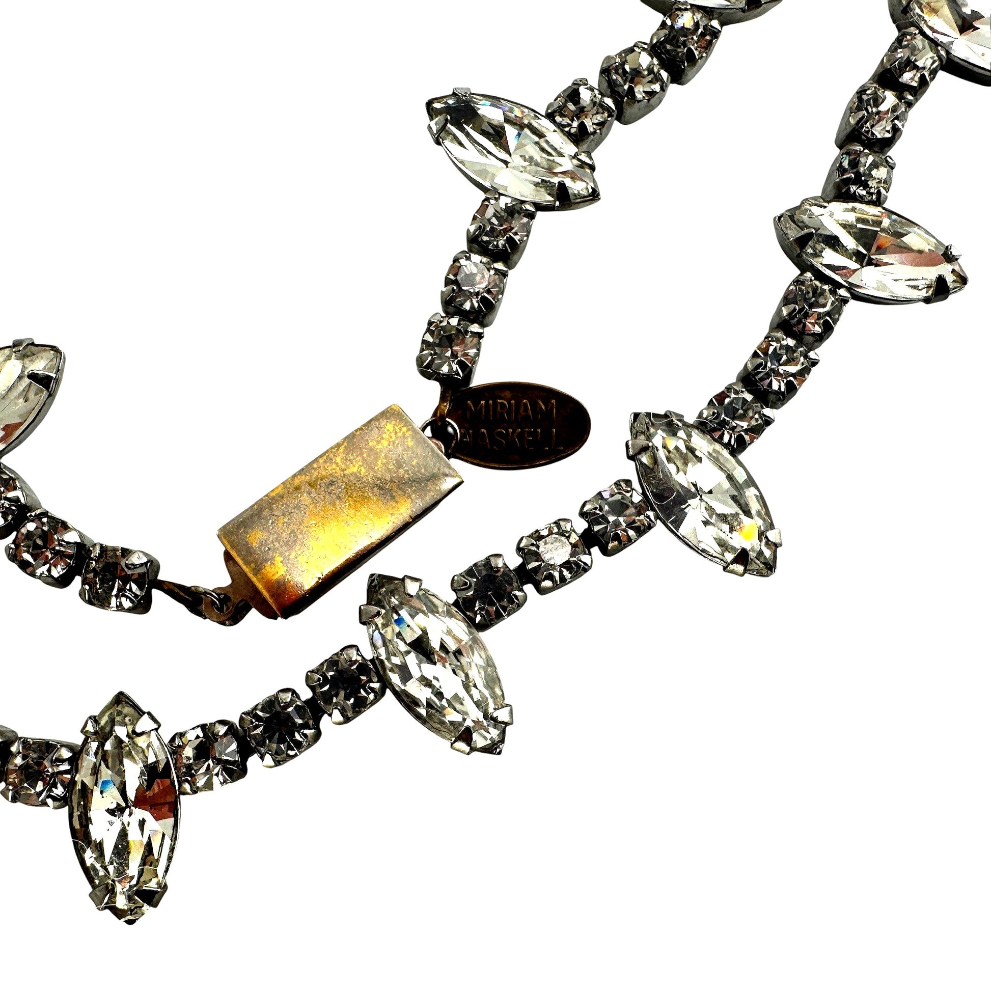 Reverse view of open-back prong settings on marquise and round rhinestone cup links with box clasp push-release mechanism ...