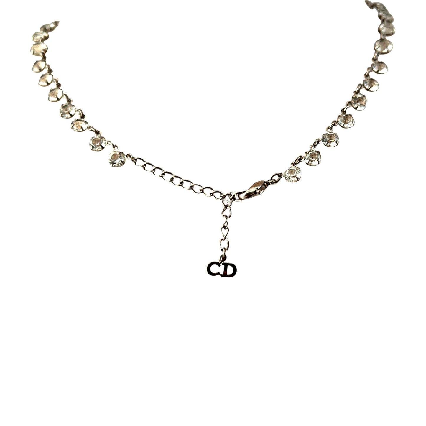 Detail of chandelier bib section showing horizontal bar with five descending rhinestone drop chains of varying lengths